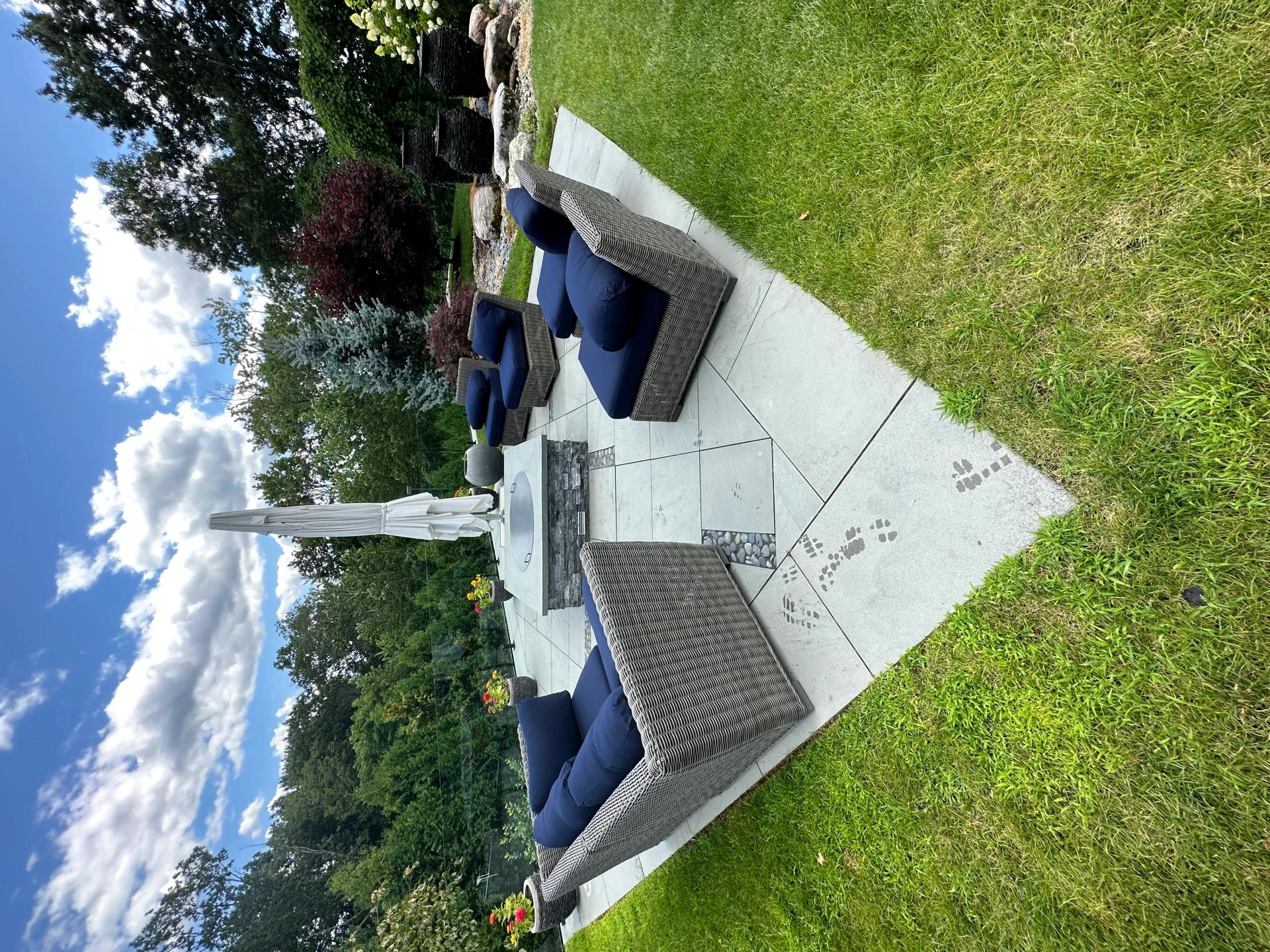 Paver patio with modern fire feature and outdoor seating