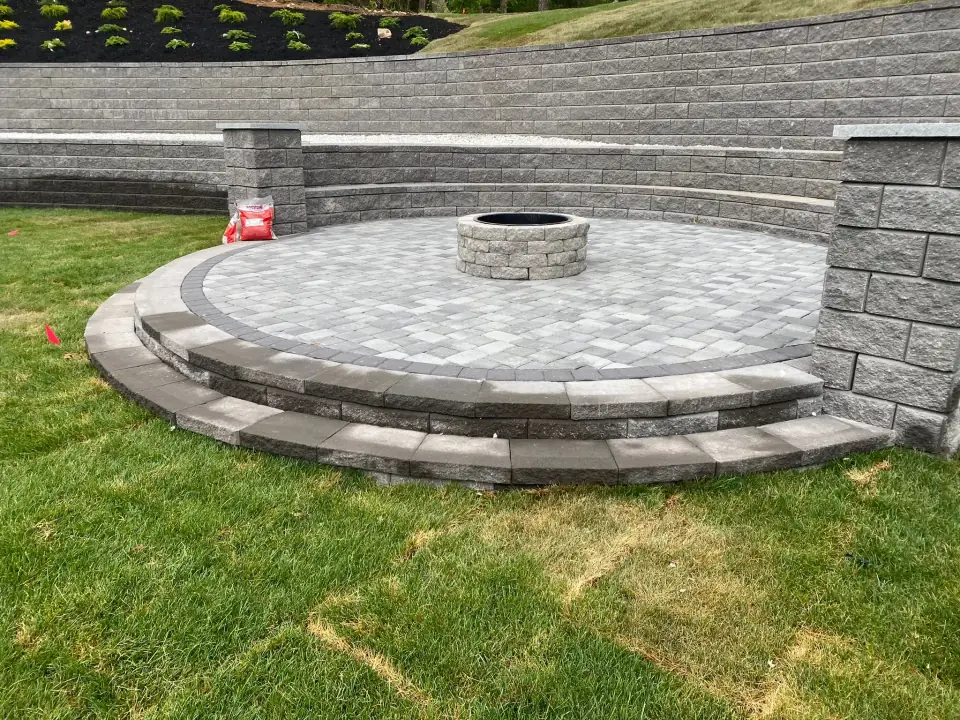 Hand-set curved stone patio in Barnstable, MA